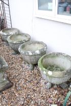 Set of four large reconstituted stone planters with grape & vine decoration, raised upon claw feet.