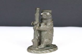 A cast metal table top vesta case in the form of a bear.