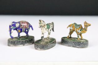 A collection of three sterling silver and enamel miniature animal figures to include an elephant,