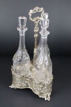 19th Century silver plated three-bottle decanter stand with pierced scrolling & floral detail,