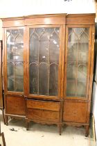 Mahogany and Cross-banded Breakfront Display Cabinet or Bookcase in the Regency manner decorated