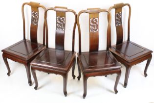 Set of Four Chinese Hardwood Dining Chairs, the pierced splats with dragon design and with solid