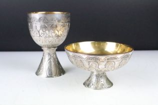 Silver plated 'Last Supper' chalice & footed dish depicting the symbols of the four Evangelists,
