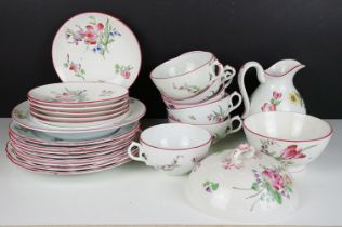 French Luneville part tea service having floral printed details and pink rims. Printed black marks