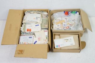 A large collection of British and world stamps on envelopes together with a collection of loose