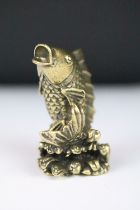 A Chinese brass ornamental figure in the form of a Koi Carp, stands approx 6cm in height.