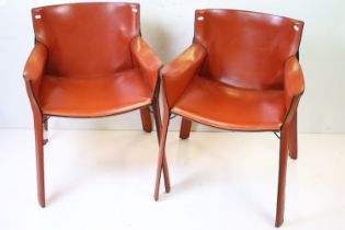 Pair of Contemporary Tan Leather Elbow Chairs with black trim n the manner of Mario Bellini CAB