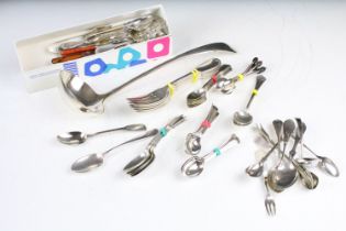 A collection of cutlery to include hallmarked sterling silver teaspoons, silver coffee spoons and