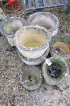 Collection of eight reconstituted stone garden planters of varying sizes and forms, largest approx