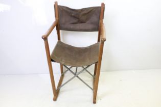 Mid century style Folding Chair with brown leather back and seat designed by Peter Karpf for Tripp