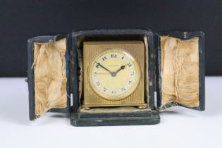An early 20th century swiss made Zenith travel clock complete with travel case.