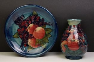 Moorcroft Finches and Fruit pattern plate together with a baluster vase, both with tube lined