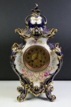 Ceramic mantle clock having moulded scrolled acanthus leaf detailing with floral detailing, and