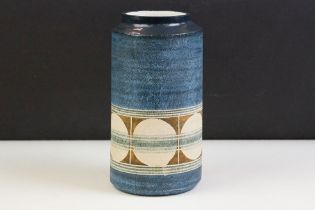 Mid Century Troika pottery vase of cylindrical form with circular pattern on a blue ground. Signed