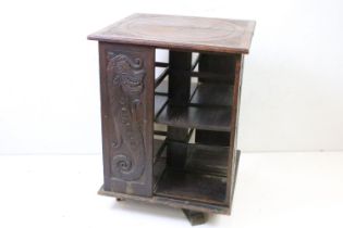 Early 20th century Hardwood Square Revolving Bookcase, possibly Asian, the side panels carved with a