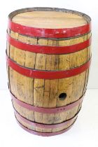Large Coopered Golden Oak Barrel or Cask, the metal bands painted red, 86cm high x 59cm diameter
