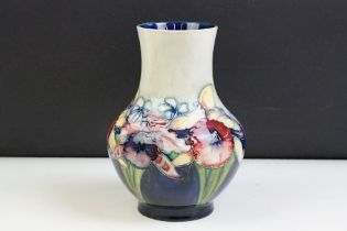 Moorcroft Orchid pattern small baluster vase with tube lined detailing. Impressed Moorcroft mark