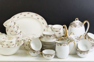 20th Century Limoges of France tea set with pink rose decoration (teapot, 12 cups & saucers, milk