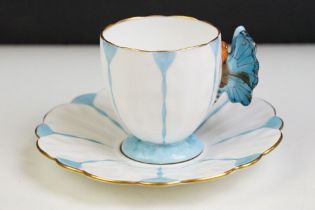 Aynsley Art Deco tea cup and saucer having a butterfly formed handle, gilt rims and blue hand