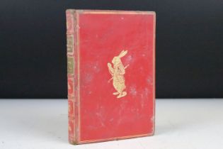 A hardbound 1869 edition of Alice's Adventures in Wonderland with forty two illustrations by John