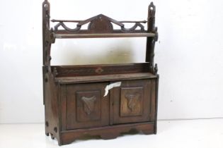 Late 19th century Gothic Revival Wooden Hanging Wall Cabinet comprising shelf over two cupboard