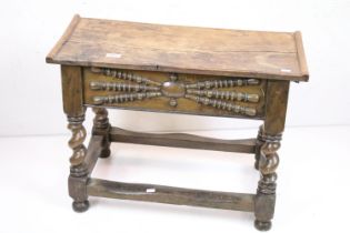 Oak Joint Box Stool in the 17th century manner, the hinged lid above a carved frieze panel, raised