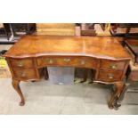 Queen Anne style Walnut and Cross-banded Desk or Dressing Table of serpentine outline with an