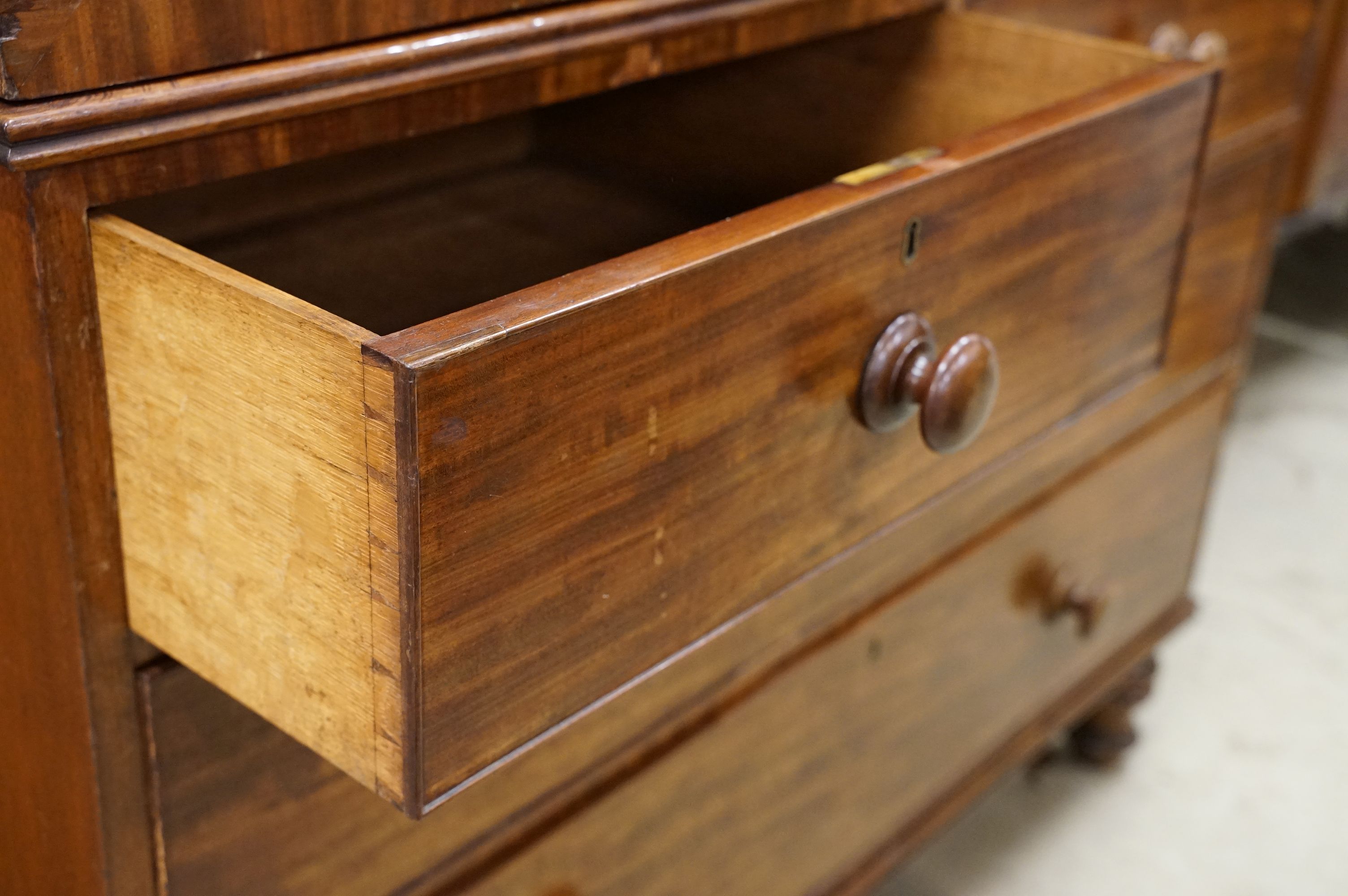 Early 19th century Mahogany Linen Press, the two panel doors opening to four tray slides, over two - Image 5 of 8