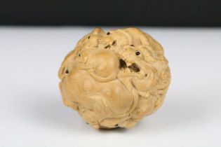 An oriental boxwood spherical carving of animals to include rats, horse, ram, monkey...etc..