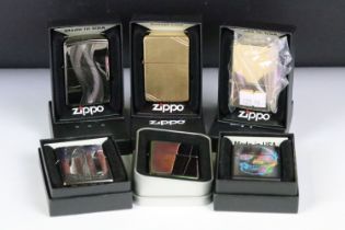 A collection of six boxed Zippo lighters to include Texas Twister, Skull, USA Flag, Vintage Brass,