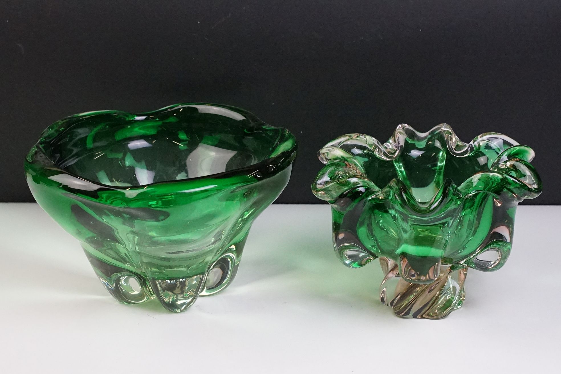 Two pieces of mid Century Czech green glass bowls to include a lobed bowl and fanned rim footed