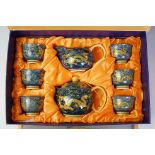 20th Century Japanese tea set with enamel dragon decoration, comprising teapot, milk jug & 6 tea