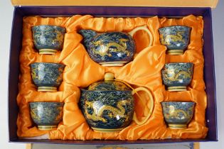 20th Century Japanese tea set with enamel dragon decoration, comprising teapot, milk jug & 6 tea