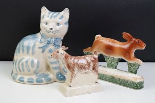 Three Rye pottery ceramic animals to include a blue and white cat, hare and goat. All with stamped