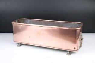Large Copper Planter of rectangular form with rounded corners and rolled edge, having a pair of lion