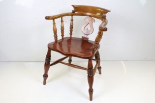 Late 19th / Early 20th century Elm Seated Captain's type Chair with pierced carved splat and