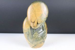 Zimbabwean carved & polished stone sculpture depicting a stylised human, signed 'E. Chiwaridzo' to
