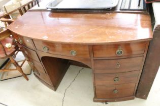 19th century Bow Front Mahogany Kneehole Desk or Dressing Chest with an arrangement of nine