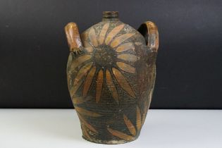 Earthenware Oil Jar with sunflower design, signed to the body