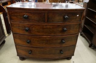 Early 19th century Bow Fronted Mahogany Chest of Two Short over Three Long Drawers raised on bun