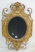 Antique Giltwood and Gesso Framed Shaped Mirror in the Rococo style with oval bevelled plate, 95cm x