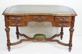 19th century Mahogany Desk of kidney outline, green leather inset top with fluted carved edge, the