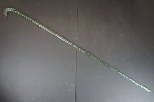 19th Century Nailsea green glass walking cane of spiralling twisted form, approx 116cm long