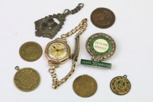 An early 20th century ladies 9ct gold cased wristwatch together with a quantity of medals /