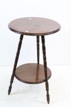 Early 20th century Mahogany Circular Wine or Lamp Table raised on three turned ringed legs united by