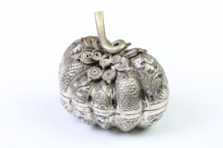 A white metal (Tests Silver) Cambodian Pumpkin shaped betel nut holder, Repousse decoration with