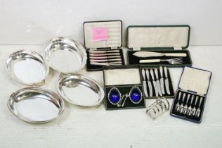 A small collection of mixed silver plate to include cased cutlery sets, toast rack and serving