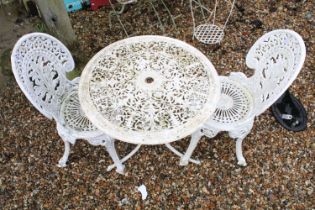 White painted cast metal patio table with two matching chairs. (Table approx 65cm high)