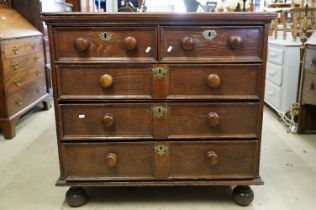 18th century Oak Chest of two short over three long drawers with moulded fronts raised on bun