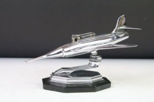 Mid Century 1960s chrome plated table lighter in the form of a plane raised on a stepped hexagonal